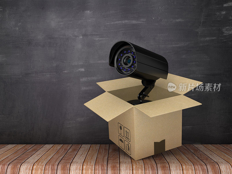 木地板上带摄像头安全的纸箱-黑板背景- 3D渲染
